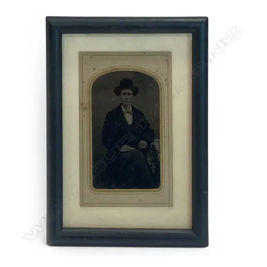Card-mounted tintype - seated man in hat,